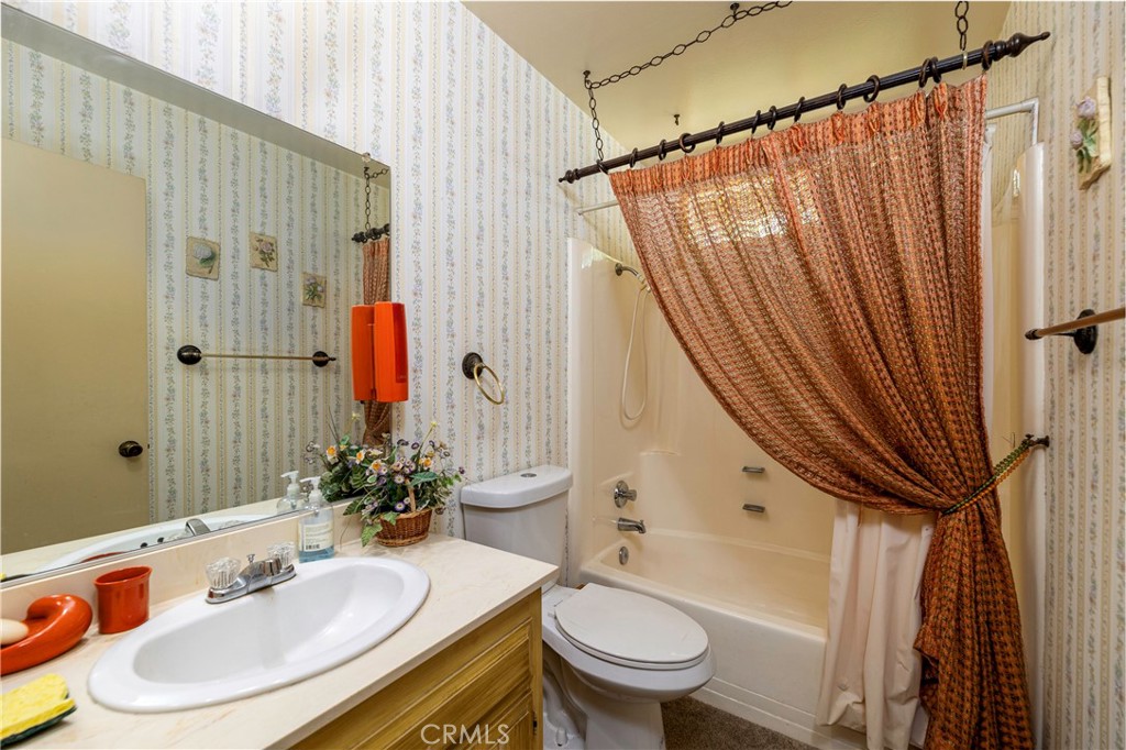 1085 Tamarack Avenue Brea, CA 92821 - Photo 18 of 28 a bathroom with a sink and a mirror
