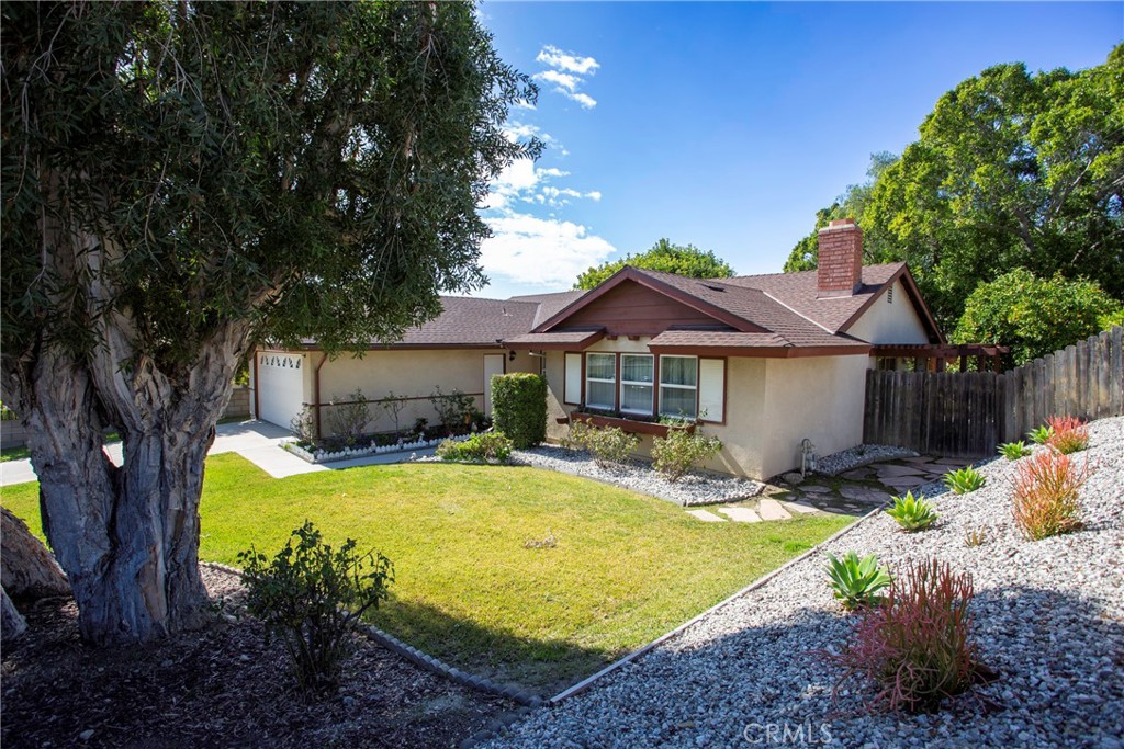 1085 Tamarack Avenue Brea, CA 92821 - Photo 2 of 28 a front view of house with swimming pool and green space