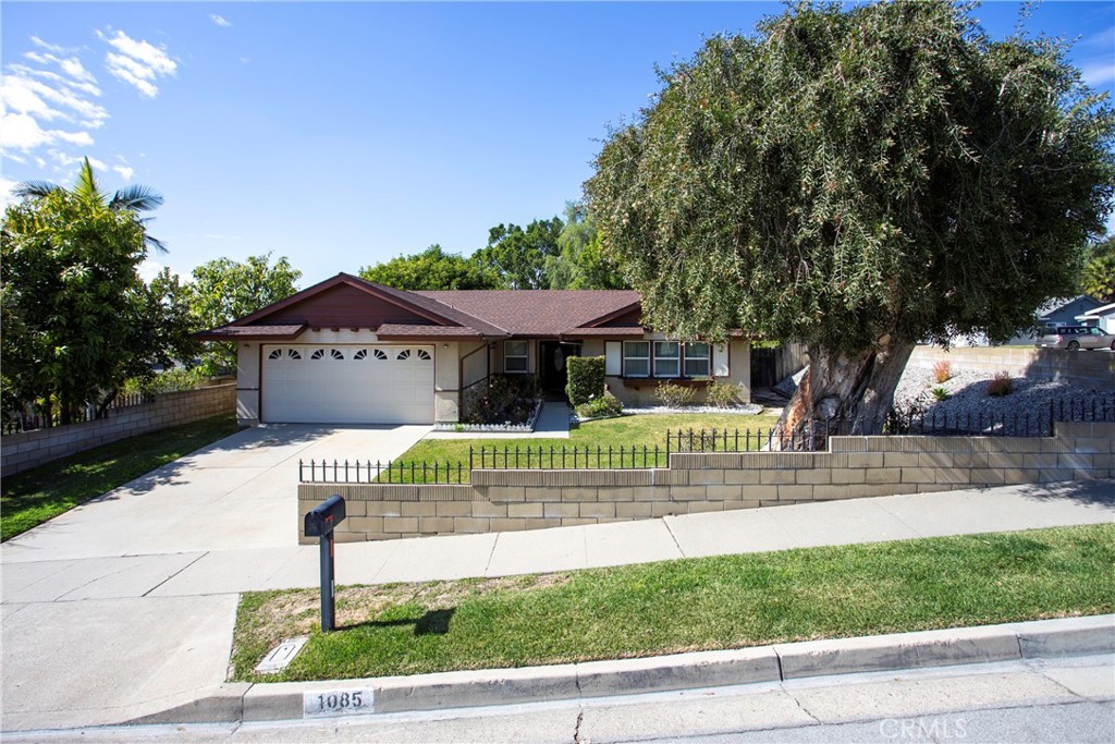 1085 Tamarack Avenue Brea, CA 92821 - Photo 28 of 28 a front view of a house with a garden
