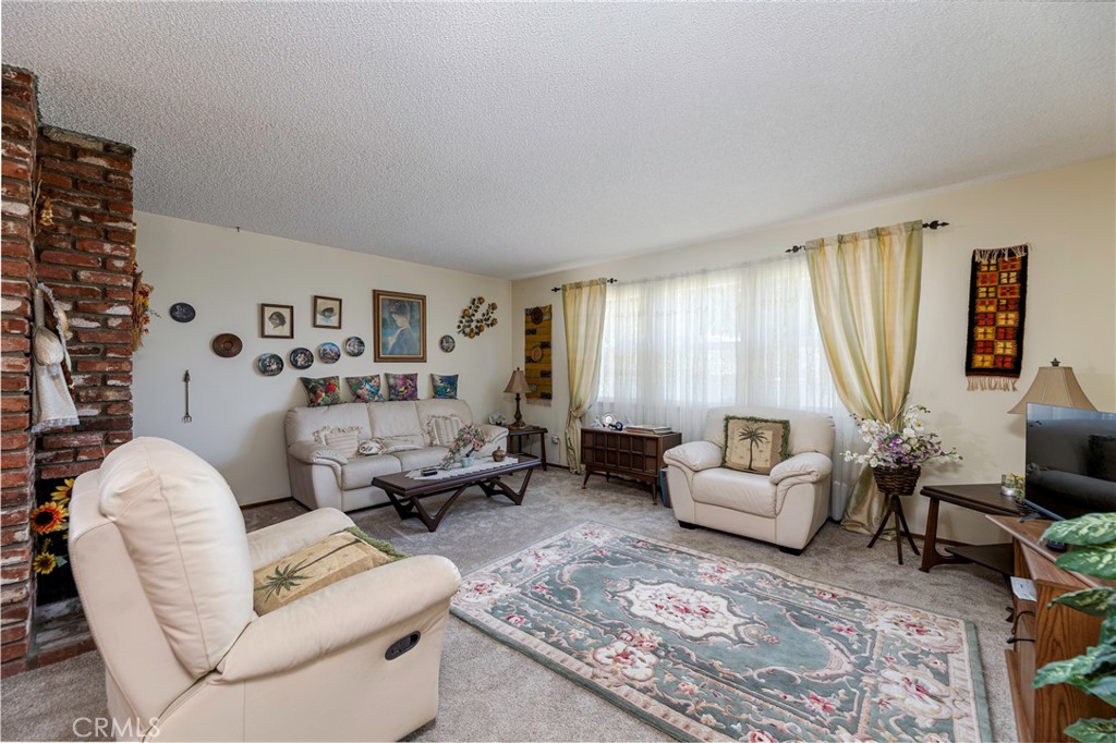 1085 Tamarack Avenue Brea, CA 92821 - Photo 7 of 28 a living room with furniture and a large window
