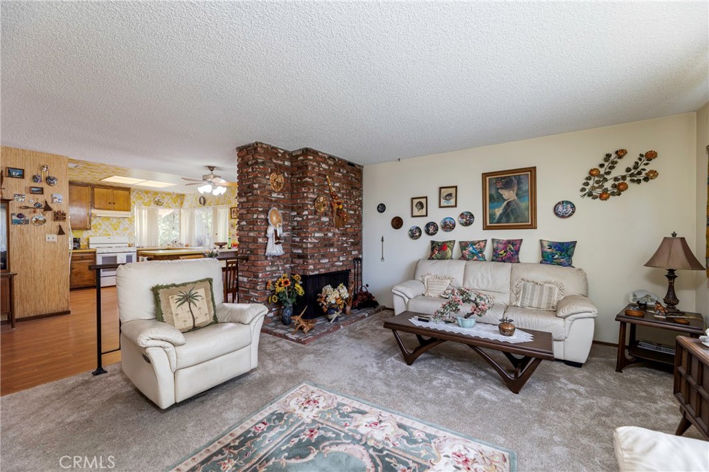 1085 Tamarack Avenue Brea, CA 92821 - Photo 8 of 28 a living room with furniture and a fireplace