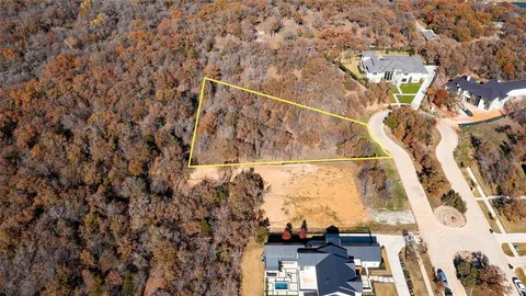 an aerial view of residential building and ocean