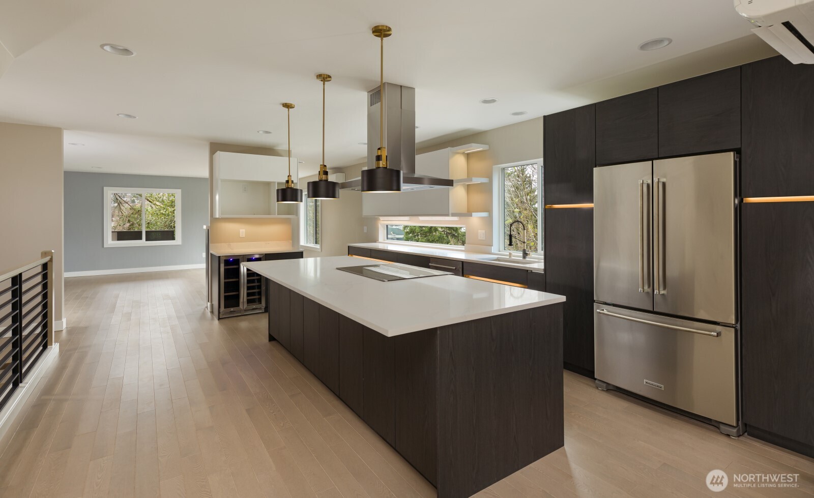 4009 21st Avenue Southwest Seattle, WA 98106 - Photo 11 of 36 a kitchen with kitchen island a counter top space a sink a refrigerator and a stove