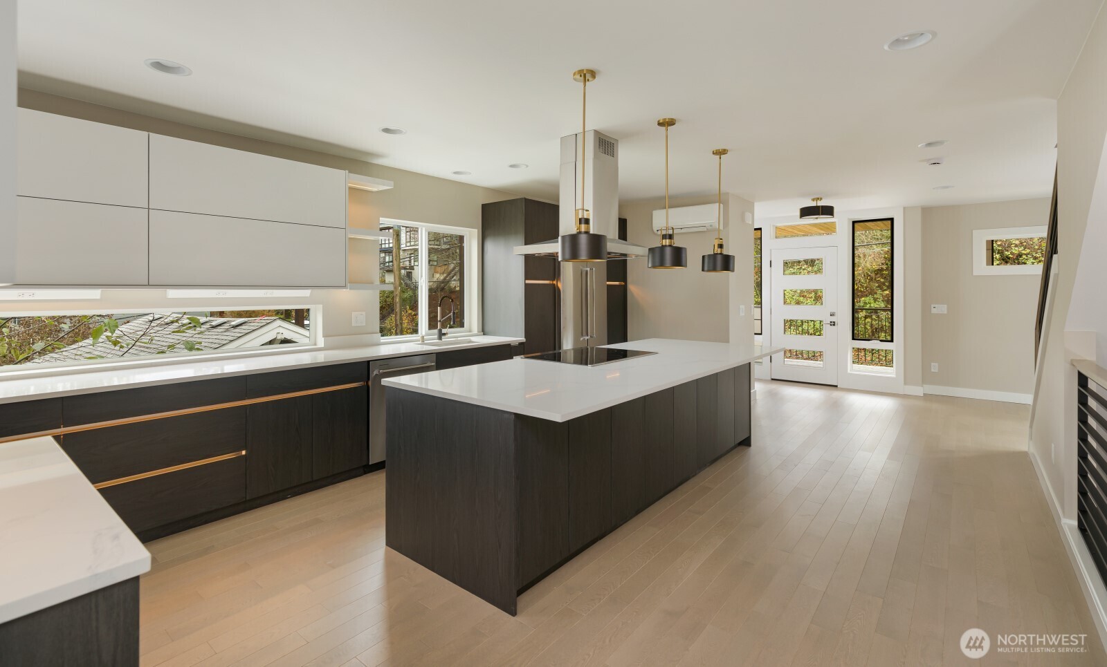 4009 21st Avenue Southwest Seattle, WA 98106 - Photo 12 of 36 a kitchen with stainless steel appliances granite countertop a sink counter space and cabinets
