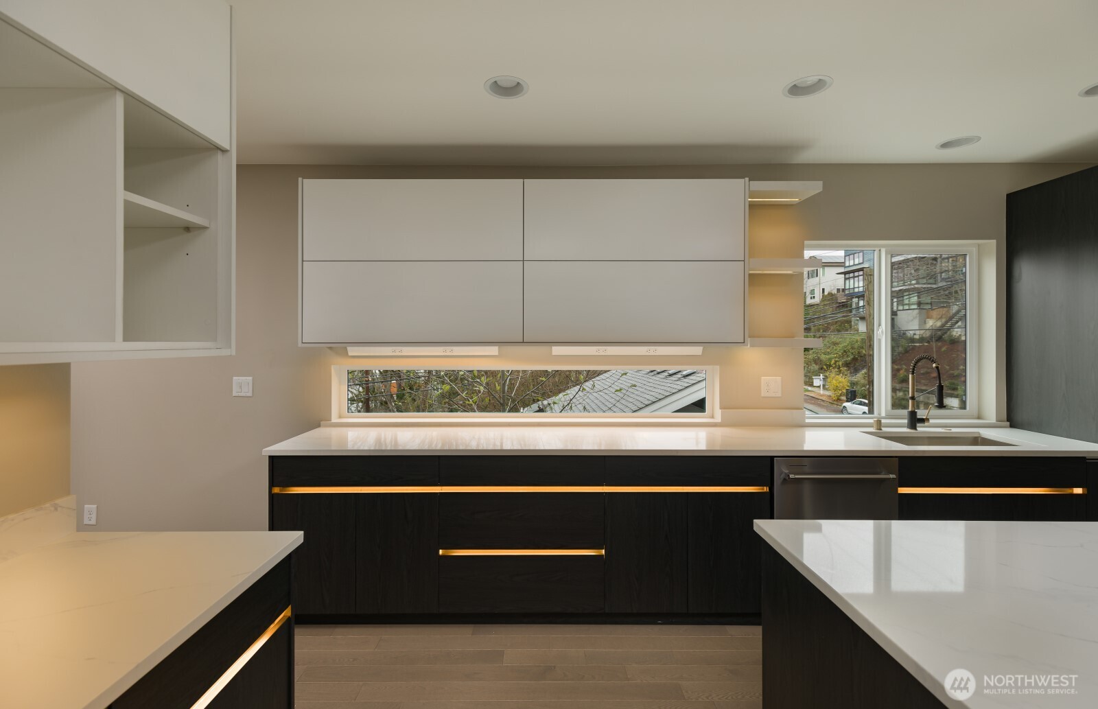 4009 21st Avenue Southwest Seattle, WA 98106 - Photo 13 of 36 a view of a kitchen with granite countertop a sink and a stove
