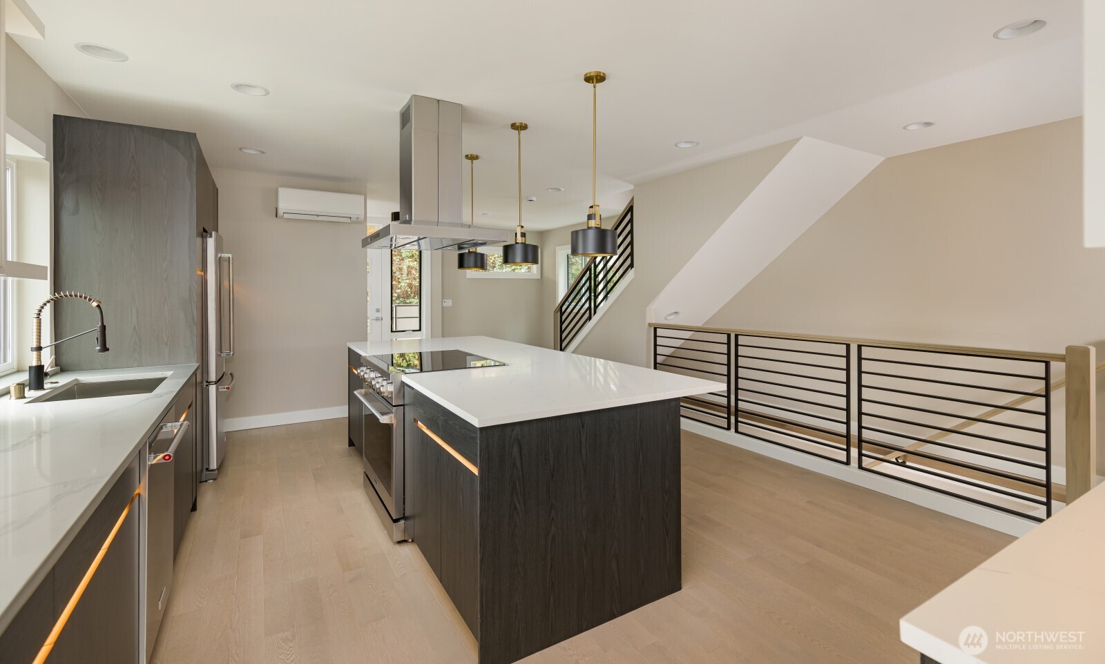 4009 21st Avenue Southwest Seattle, WA 98106 - Photo 14 of 36 a kitchen with stainless steel appliances granite countertop a sink a stove and a refrigerator
