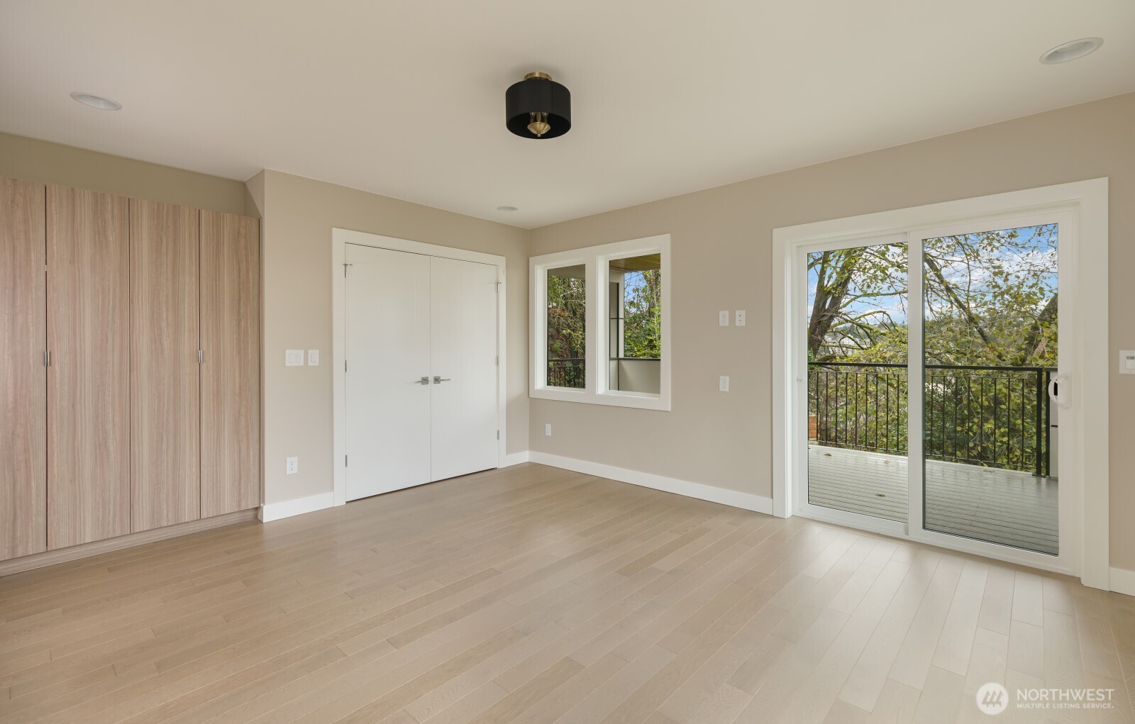 4009 21st Avenue Southwest Seattle, WA 98106 - Photo 19 of 36 wooden floor in an empty room with a window
