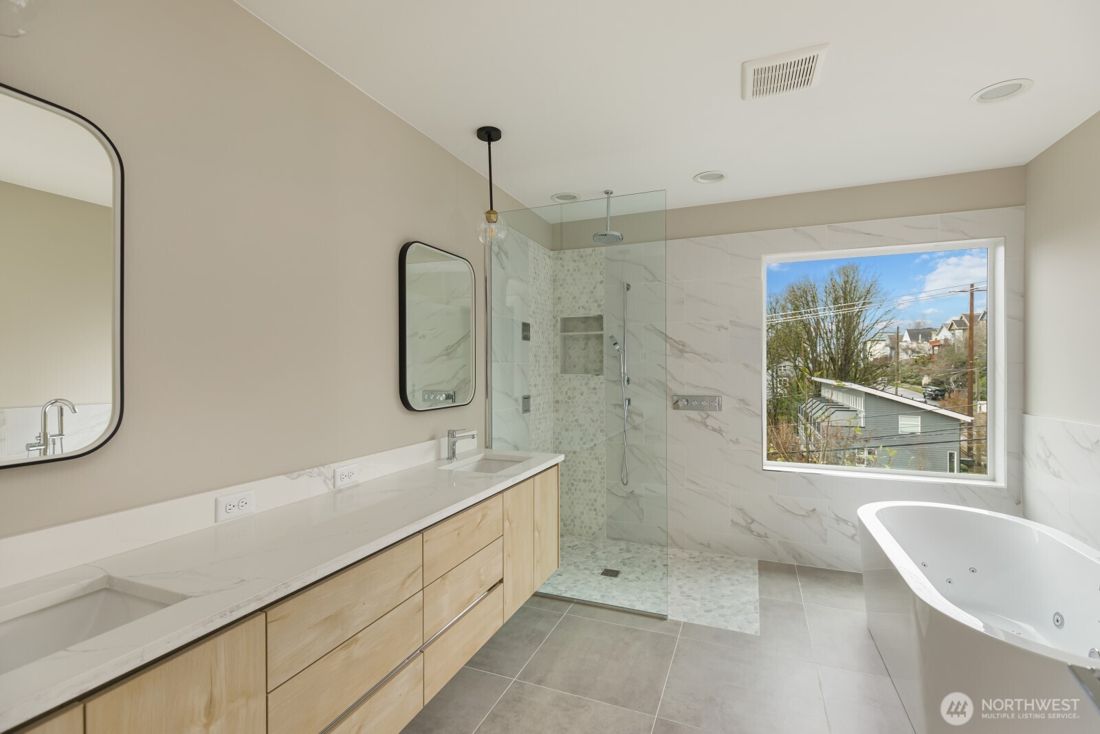 4009 21st Avenue Southwest Seattle, WA 98106 - Photo 22 of 36 a bathroom with a tub sink and mirror