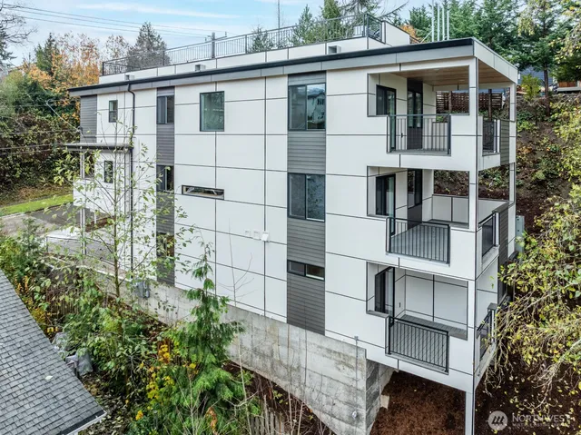 a balcony with table and chairs