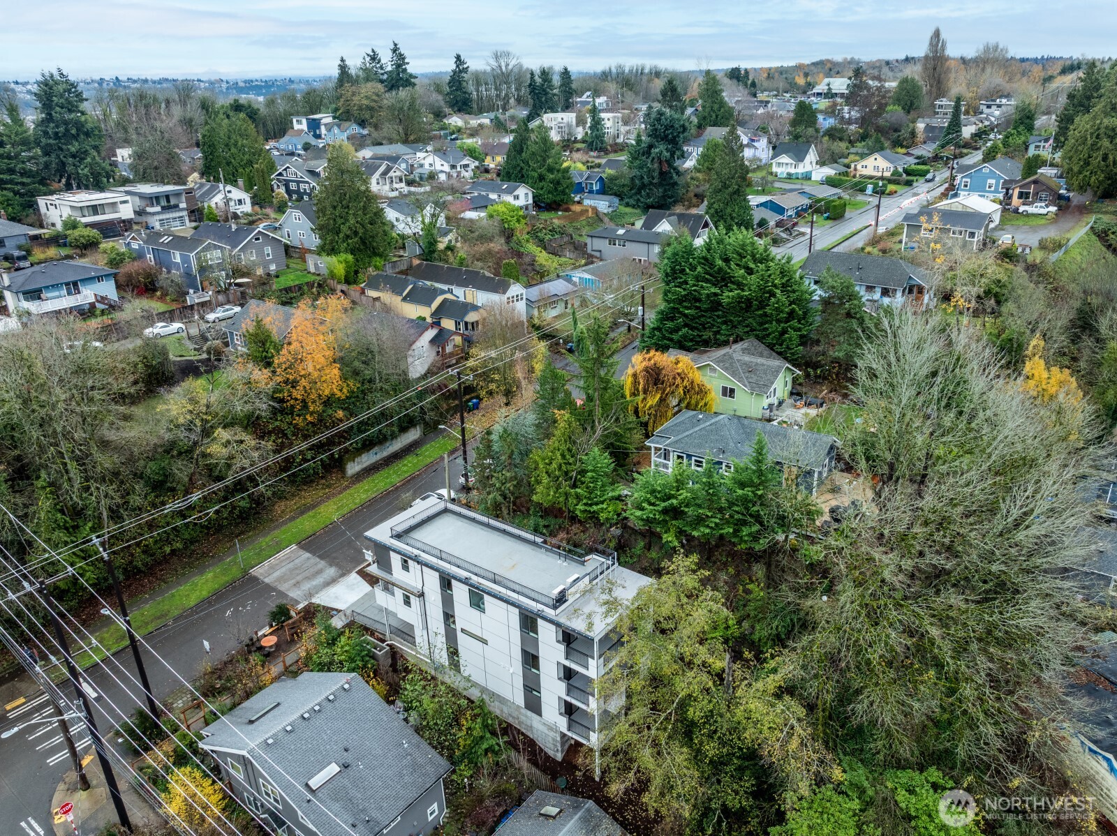 4009 21st Avenue Southwest Seattle, WA 98106 - Photo 6 of 36 an aerial view of house with yard swimming pool and lake view