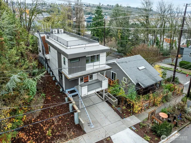 an aerial view of a house with a garden