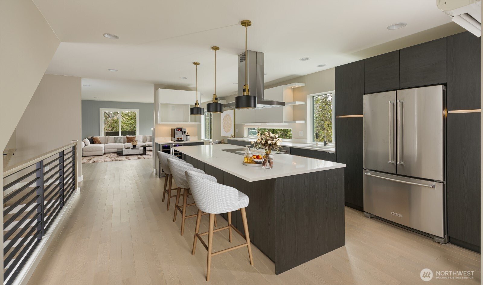 4009 21st Avenue Southwest Seattle, WA 98106 - Photo 10 of 36 a kitchen with stainless steel appliances a dining table chairs and a refrigerator