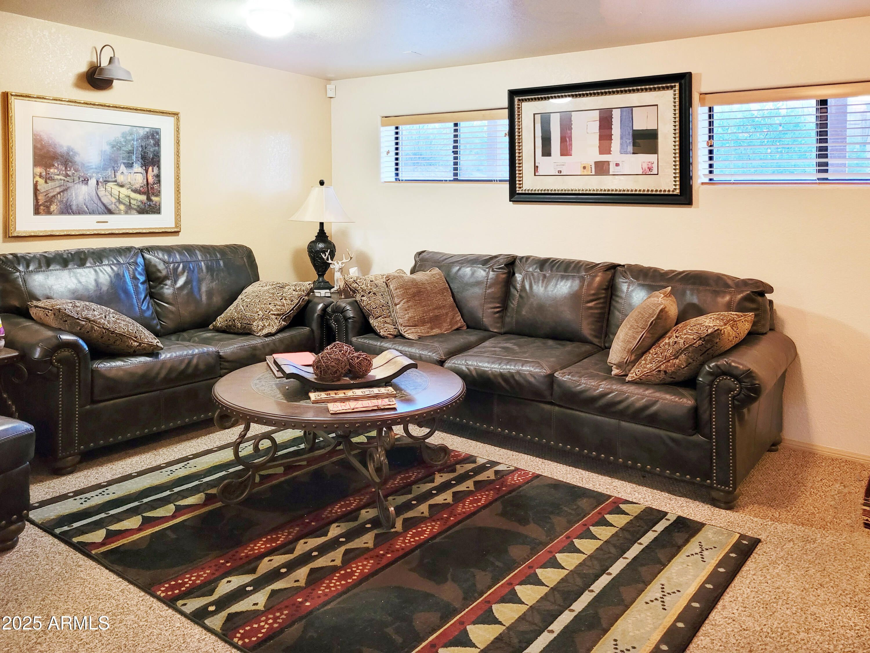 5579 Solitude Trail Loop Pine, AZ 85544 - Photo 37 of 50 a living room with furniture and a rug