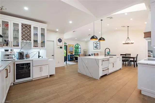a large white kitchen with lots of counter top space