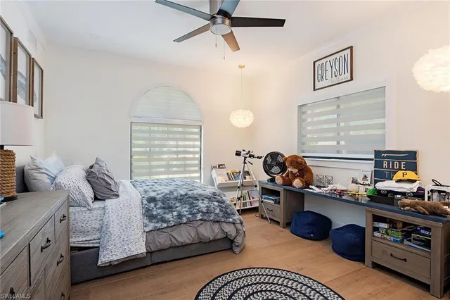 a bedroom with a bed furniture and a window