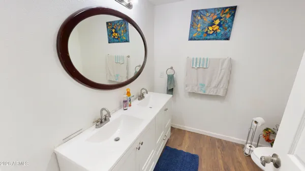 a bathroom with a sink and a mirror