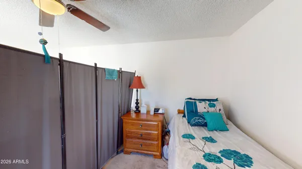 a bedroom with a bed and furniture