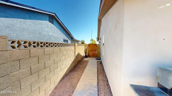 a view of a patio with table and chairs and wooden floor