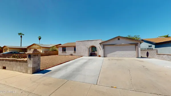 a spacious bathroom with a sink and mirror