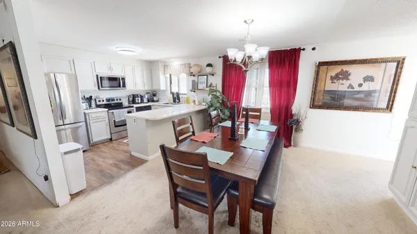 a view of a dining room with furniture