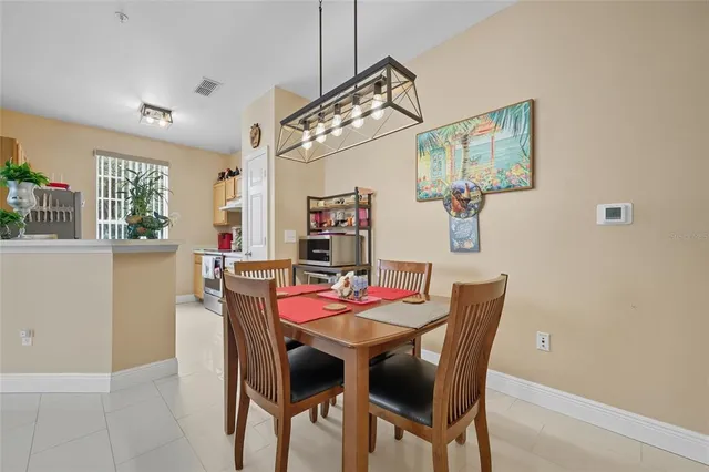 a view of a dining room with furniture and window