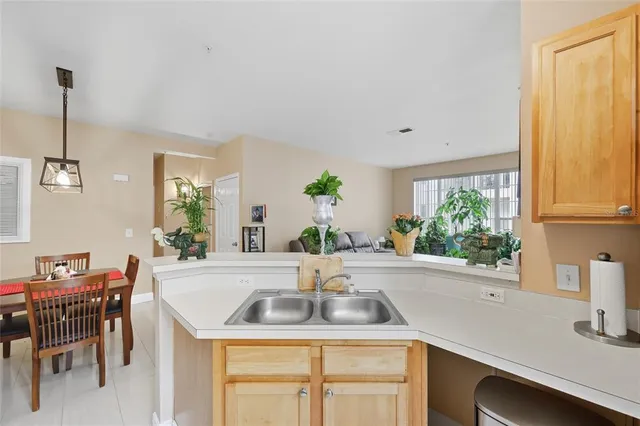 a kitchen with a sink and window