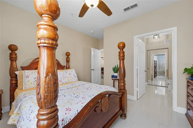 a bedroom with a bed and cabinets