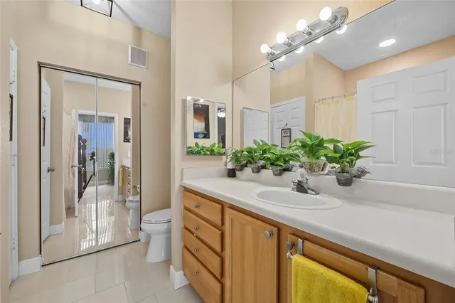 a bathroom with a sink a mirror and a shower