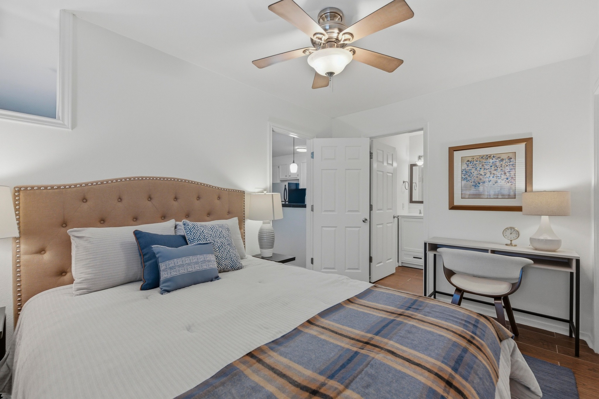 304 East 33rd Street, Unit 11 Austin, TX 78705 - Photo 12 of 27 a bedroom with bed and a chandelier