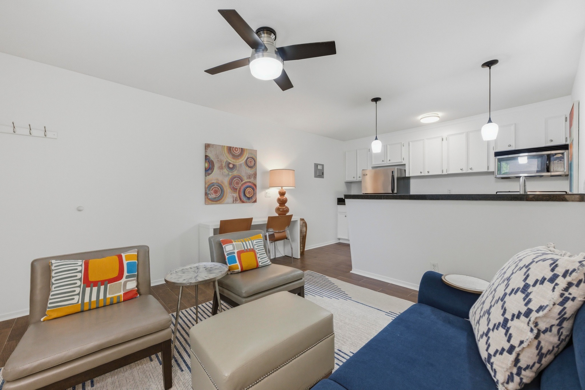 304 East 33rd Street, Unit 11 Austin, TX 78705 - Photo 2 of 27 a living room with furniture and a wooden floor