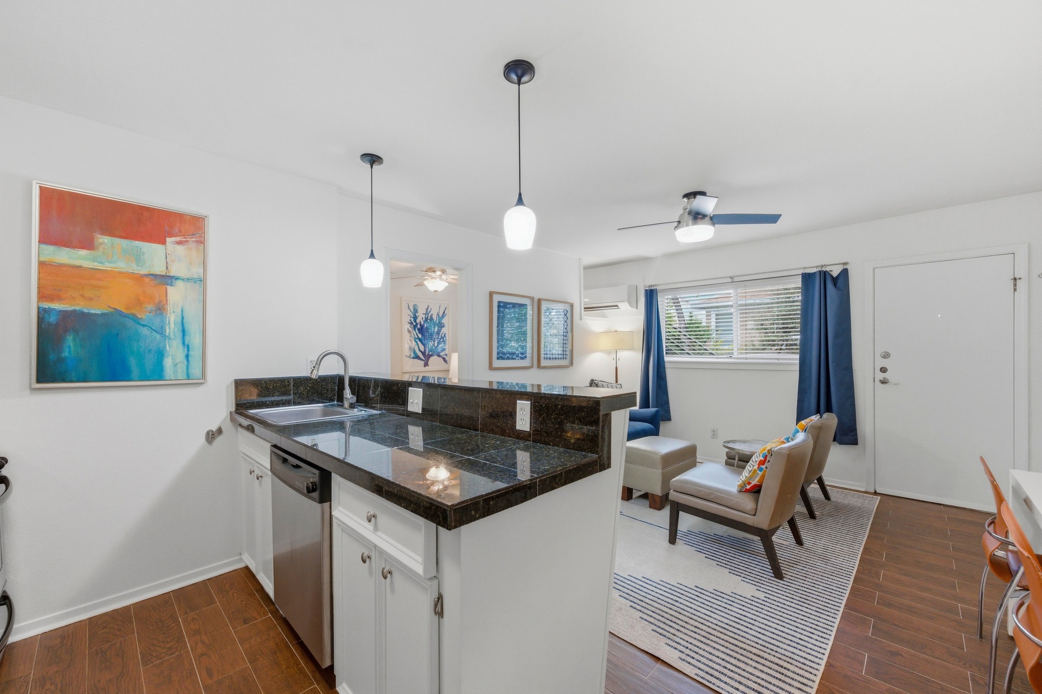 304 East 33rd Street, Unit 11 Austin, TX 78705 - Photo 8 of 27 a kitchen with a sink cabinets and wooden floor