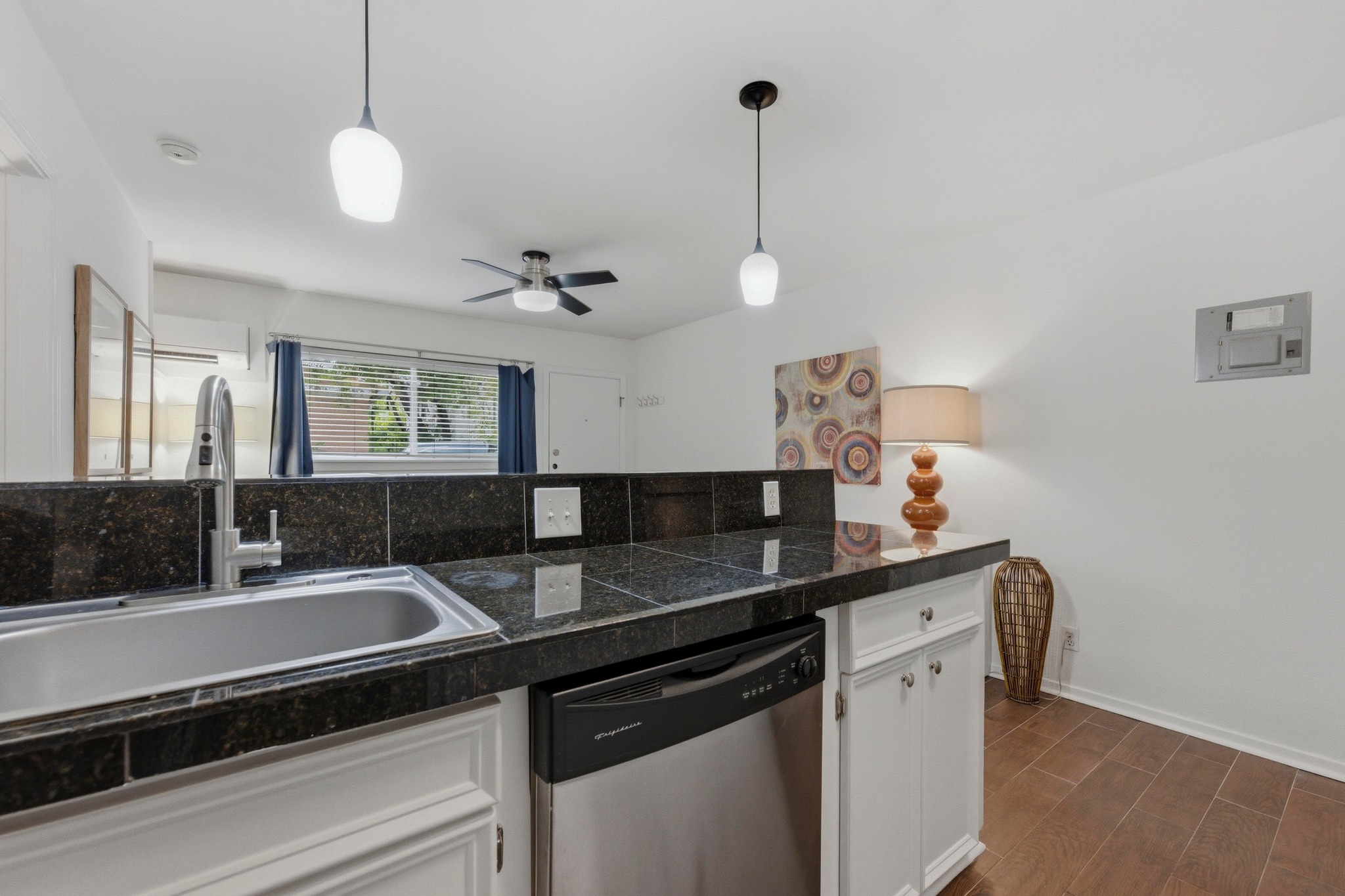304 East 33rd Street, Unit 11 Austin, TX 78705 - Photo 9 of 27 a kitchen with a sink and stove