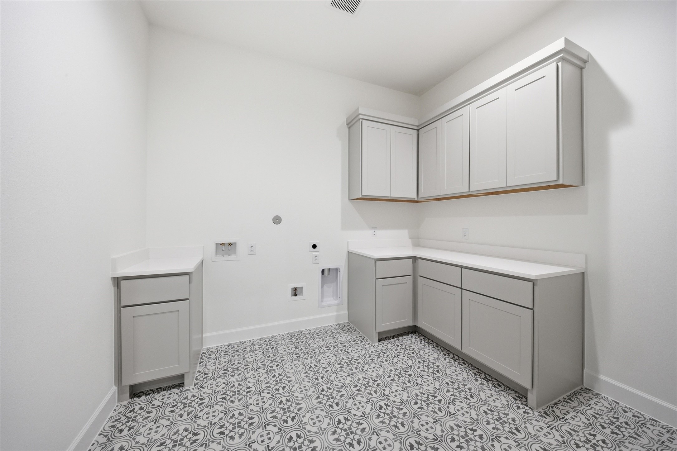 416 Venado View Court Conroe, TX 77304 - Photo 25 of 34 Bright and functional utility room featuring custom cabinetry, generous counter space