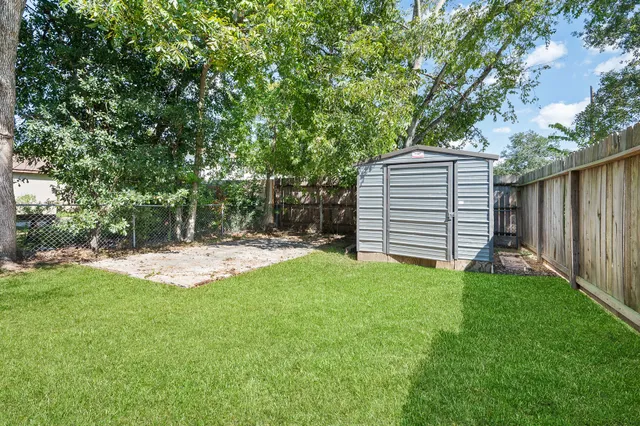 a view of a backyard with a small cabin