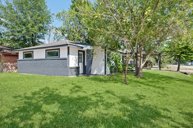 a front view of house with yard and green space