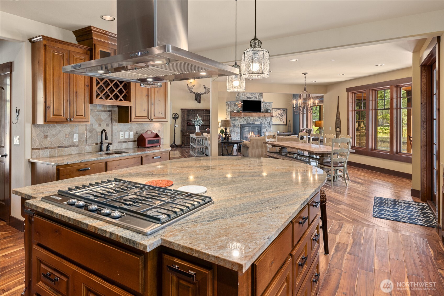 930 Coal Mine Way Cle Elum, WA 98922 - Photo 11 of 40 a kitchen with stainless steel appliances granite countertop a stove and a view of living room