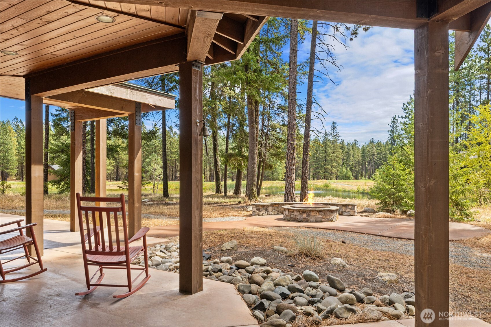 930 Coal Mine Way Cle Elum, WA 98922 - Photo 14 of 40 a view of a porch with furniture and floor to ceiling window