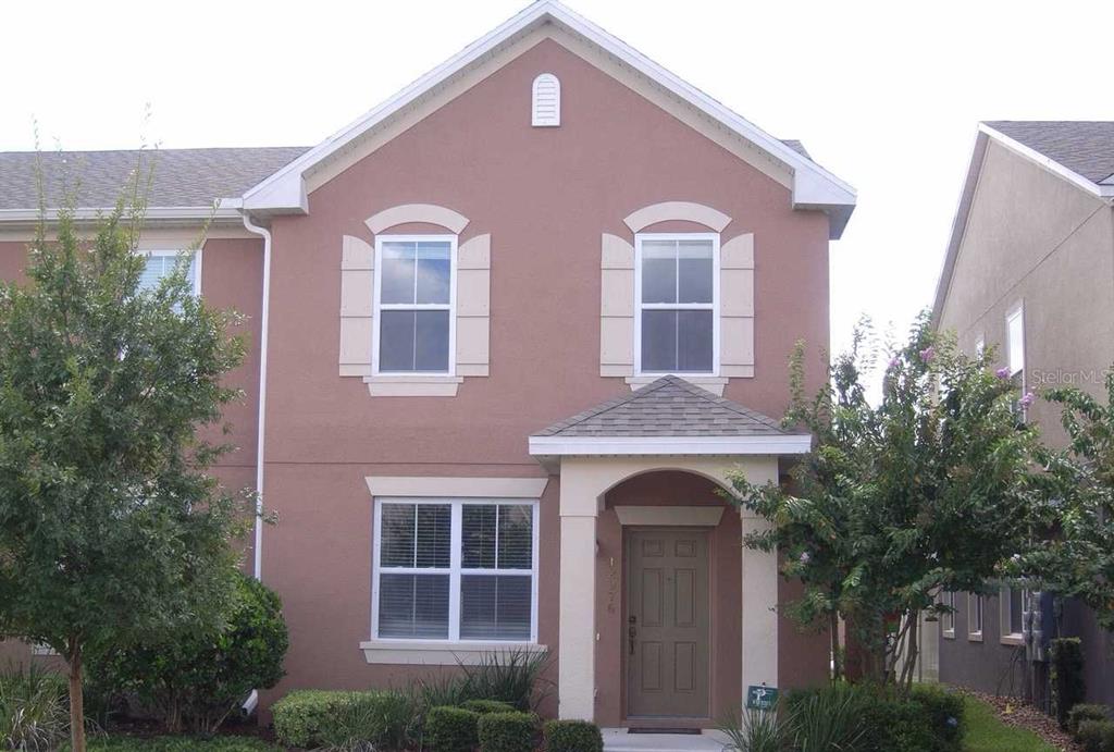 a front view of a house with yard