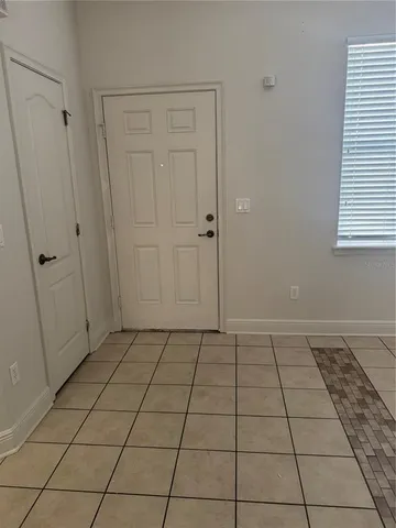 a view of an empty room and window