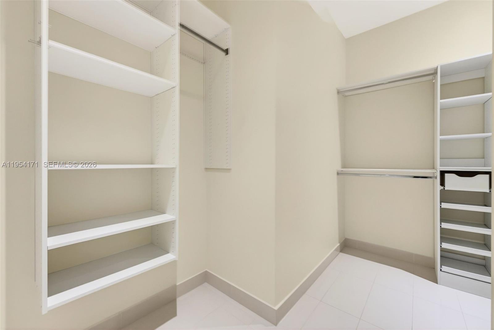 45 Southwest 9th Street, Unit LPH4609 Miami, FL 33130 - Photo 21 of 50 a view of walk in closet with empty racks