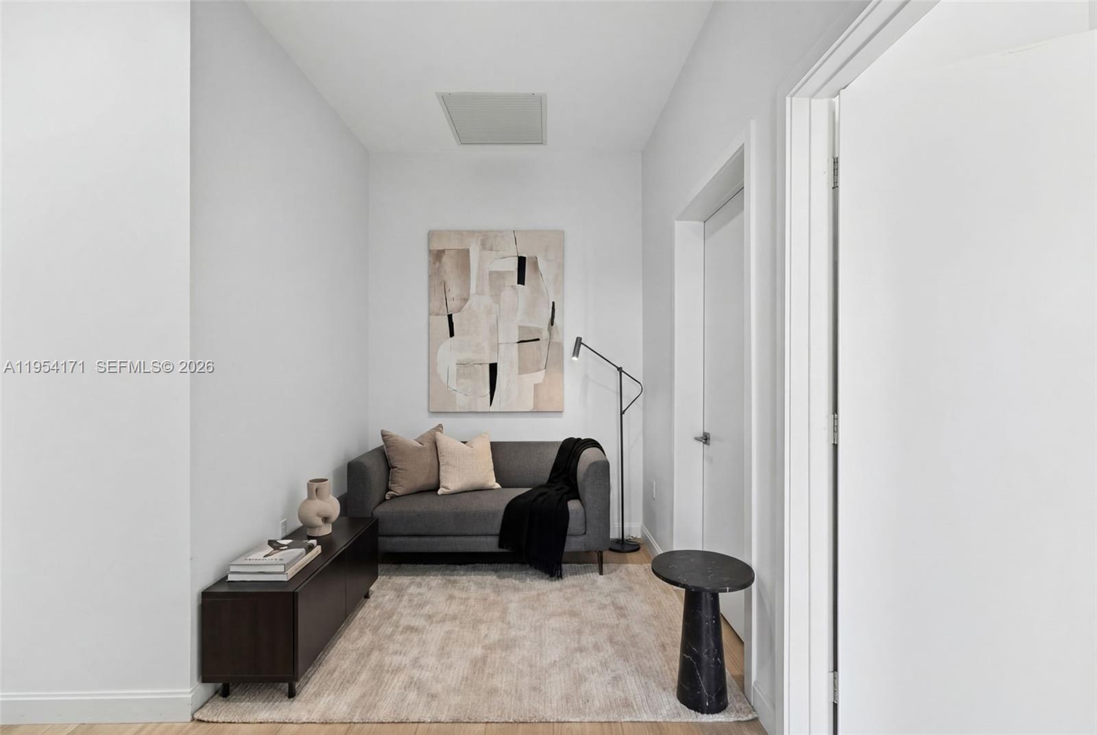 45 Southwest 9th Street, Unit LPH4609 Miami, FL 33130 - Photo 24 of 50 a living room with furniture and a rug