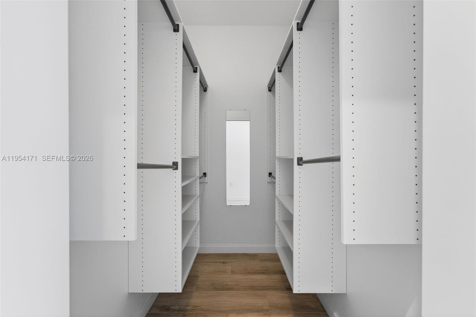 45 Southwest 9th Street, Unit LPH4609 Miami, FL 33130 - Photo 30 of 50 a view of a hallway with wooden floor and staircase