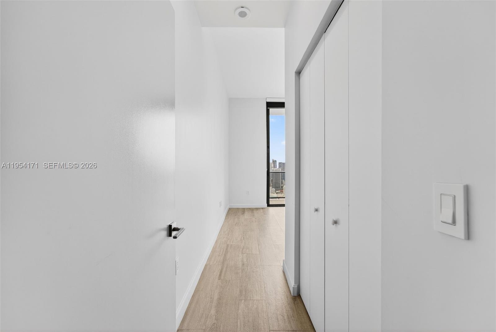 45 Southwest 9th Street, Unit LPH4609 Miami, FL 33130 - Photo 31 of 50 a view of a hallway with wooden floor and entryway