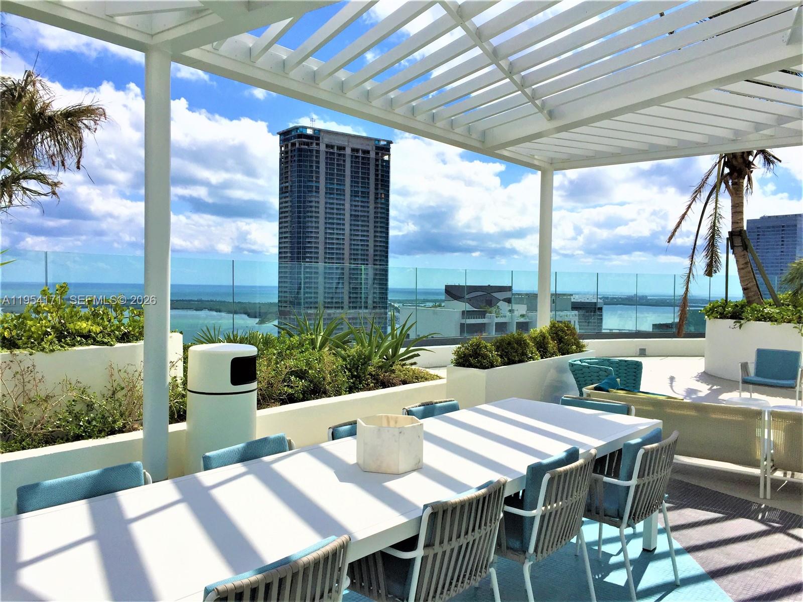45 Southwest 9th Street, Unit LPH4609 Miami, FL 33130 - Photo 39 of 50 a view of an outdoor dining space with furniture