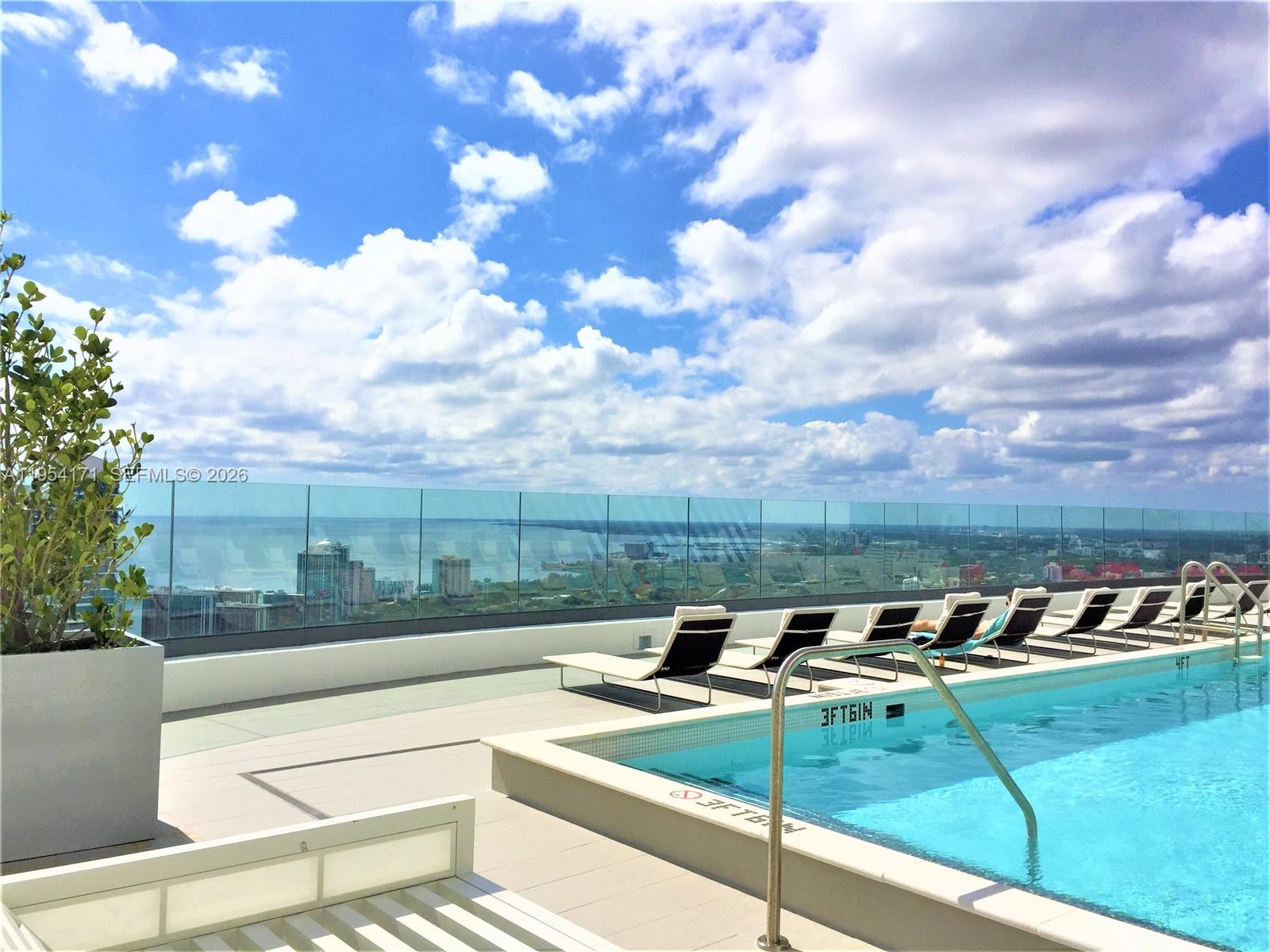 45 Southwest 9th Street, Unit LPH4609 Miami, FL 33130 - Photo 41 of 50 a view of a terrace with a bench
