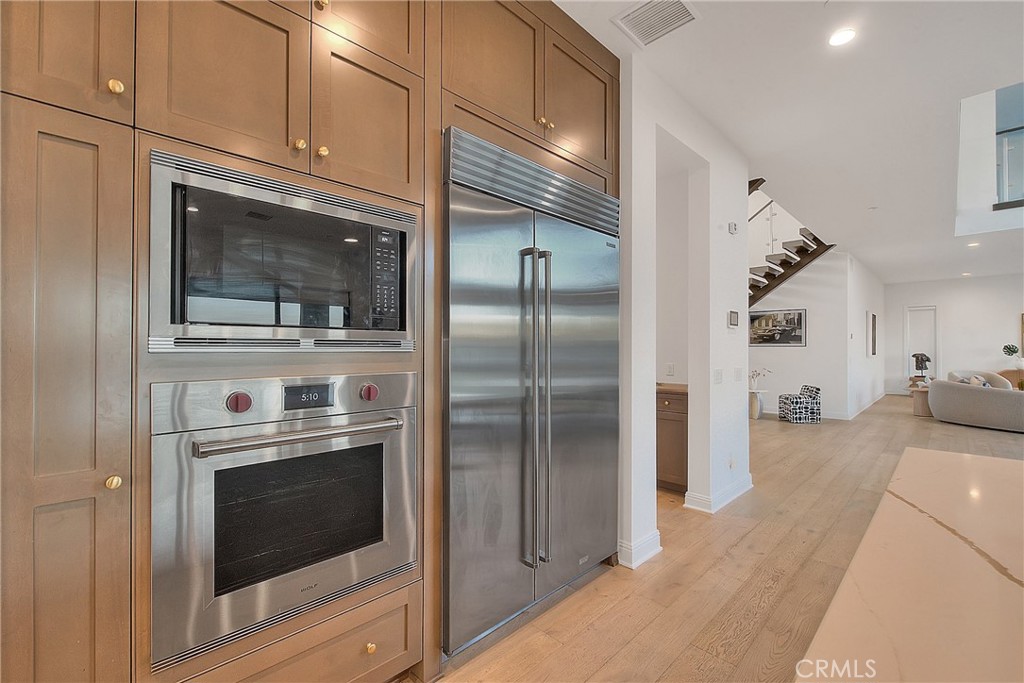20164 Galway Lane Porter Ranch, CA 91326 - Photo 13 of 74 a kitchen with cabinets and stainless steel appliances