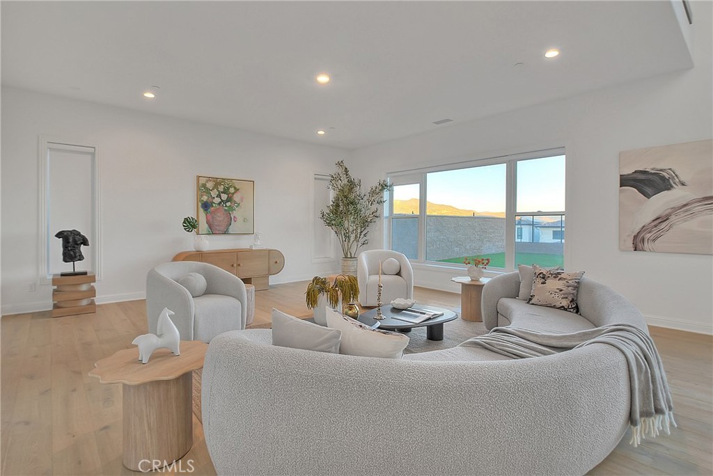 20164 Galway Lane Porter Ranch, CA 91326 - Photo 22 of 74 a living room with furniture and a large window