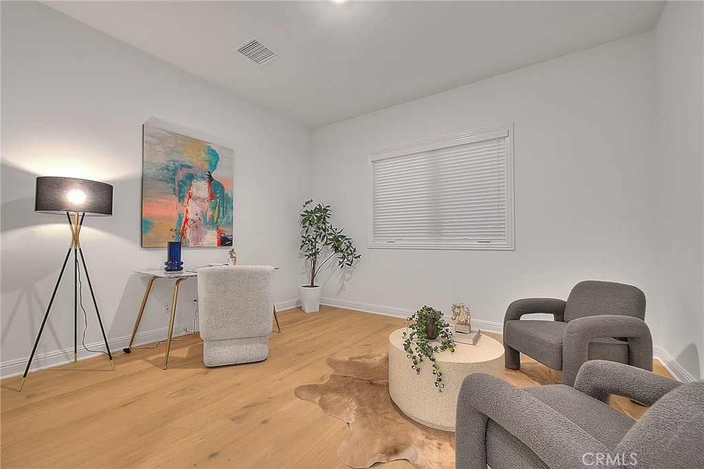 20164 Galway Lane Porter Ranch, CA 91326 - Photo 27 of 74 a living room with furniture and a lamp