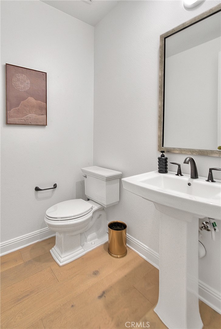 20164 Galway Lane Porter Ranch, CA 91326 - Photo 29 of 74 a bathroom with a toilet sink and mirror