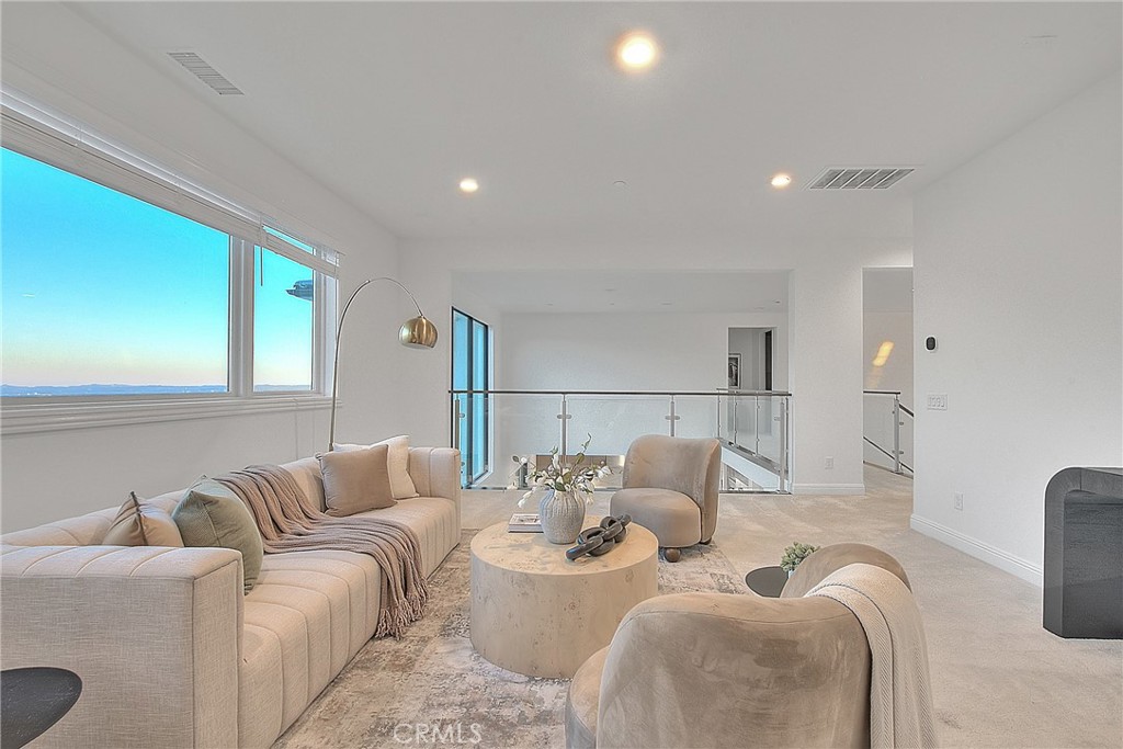 20164 Galway Lane Porter Ranch, CA 91326 - Photo 32 of 74 a living room with furniture and a large window